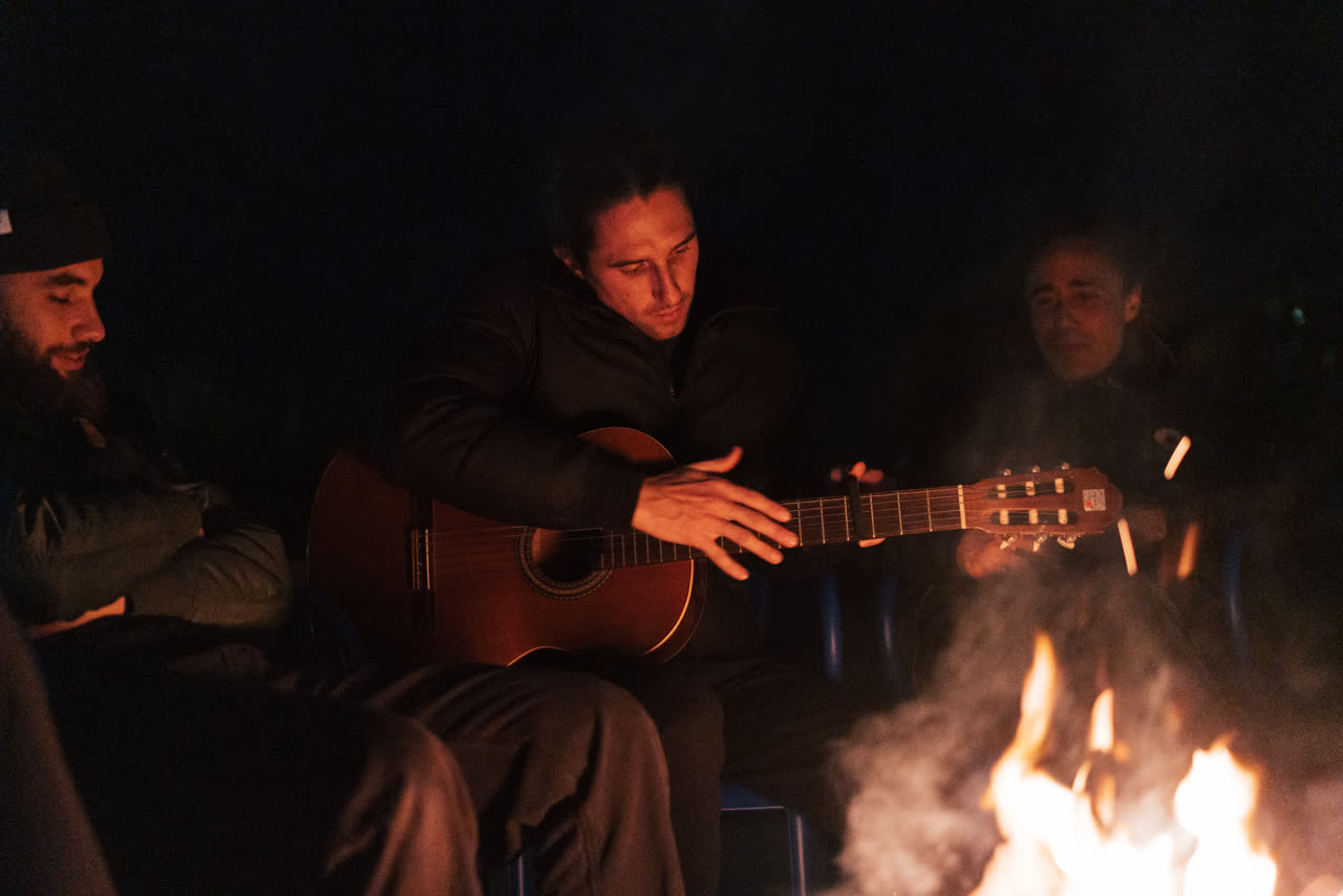 Live music around the fire at night